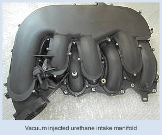 Vacuum injected urethane intake manifold